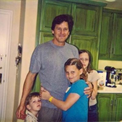 Tim Matheson is holding Cooper, Molly, and Emma close to him in the picture.